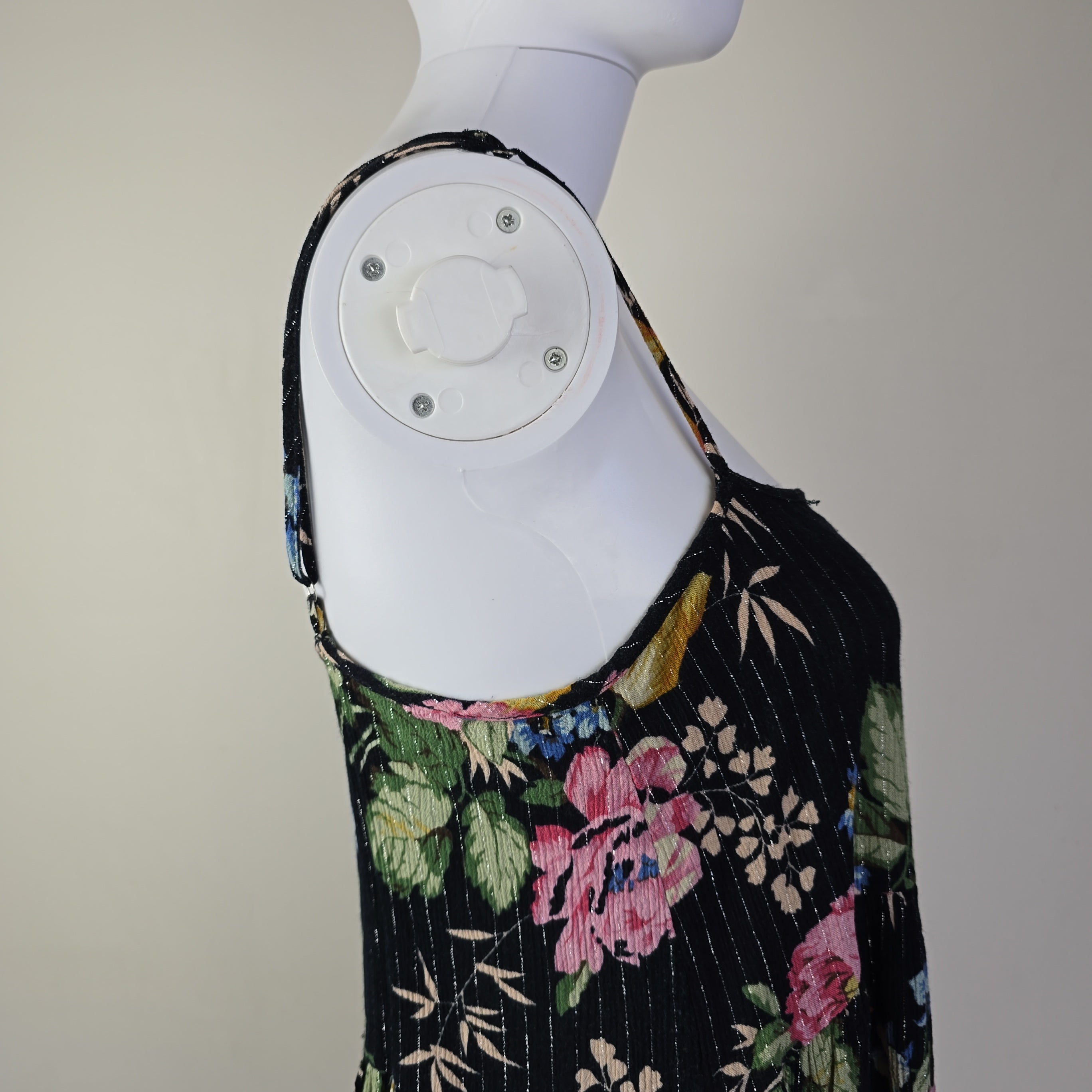 Black floral-patterned top on a light background