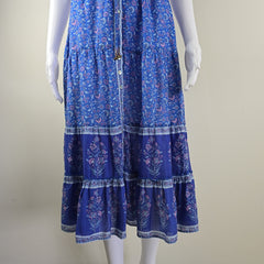 Blue patterned dress on a mannequin against a plain background