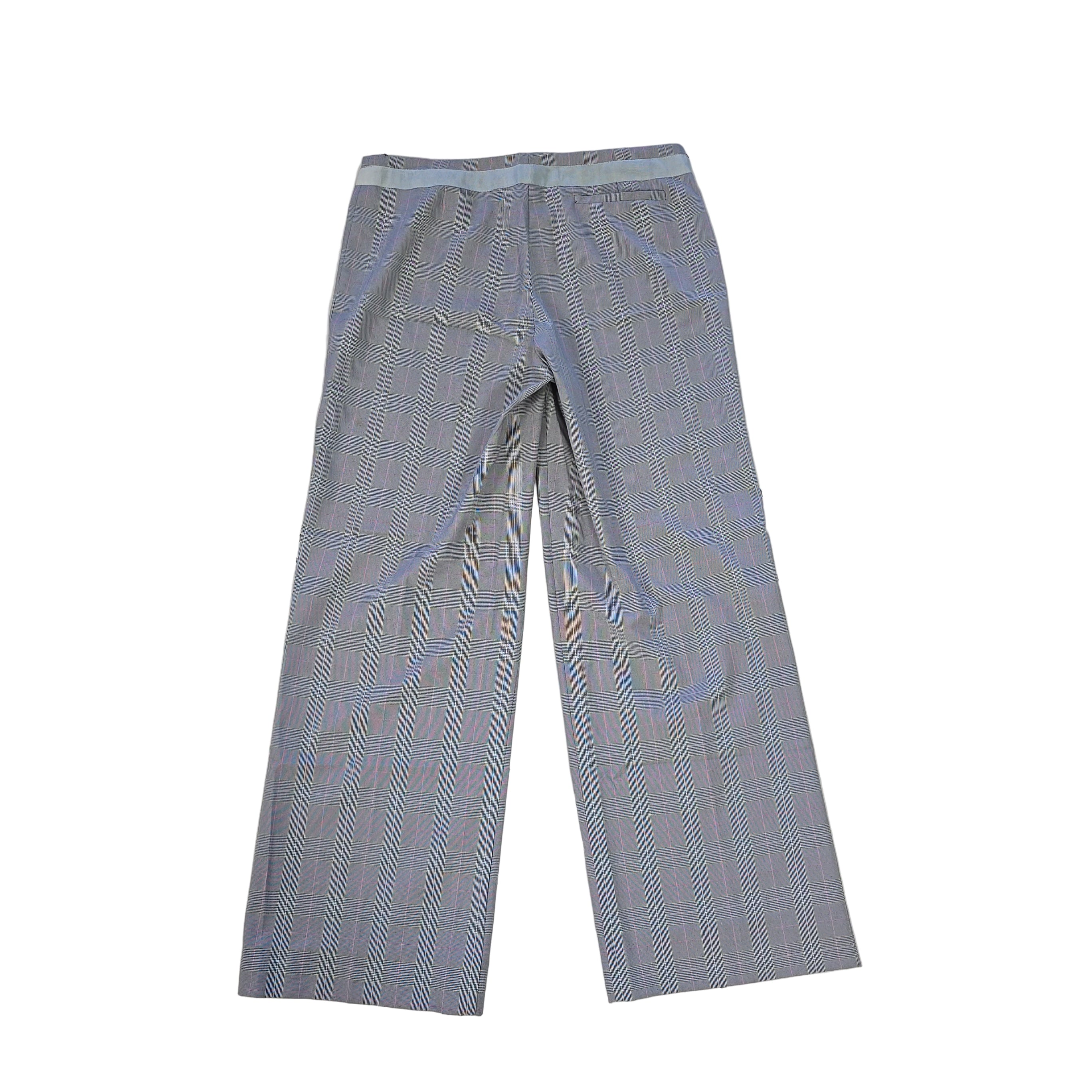 Pair of gray checkered pants on a tiled floor