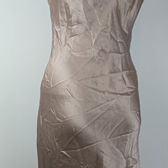 Brown crumpled fabric on a light gray background