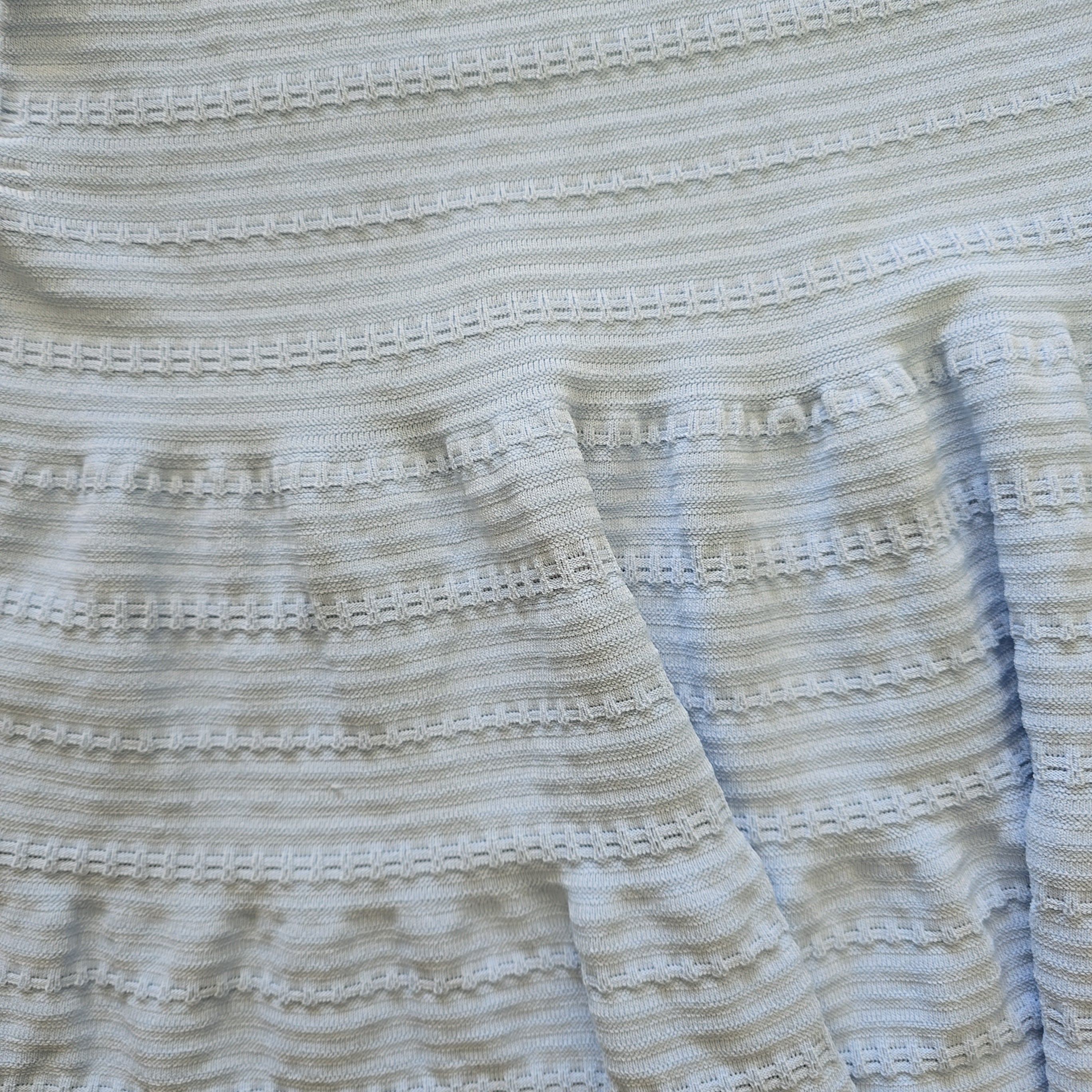 Close-up of textured fabric with a subtle pattern