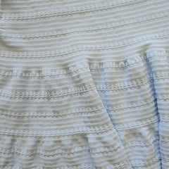 Close-up of textured fabric with a subtle pattern