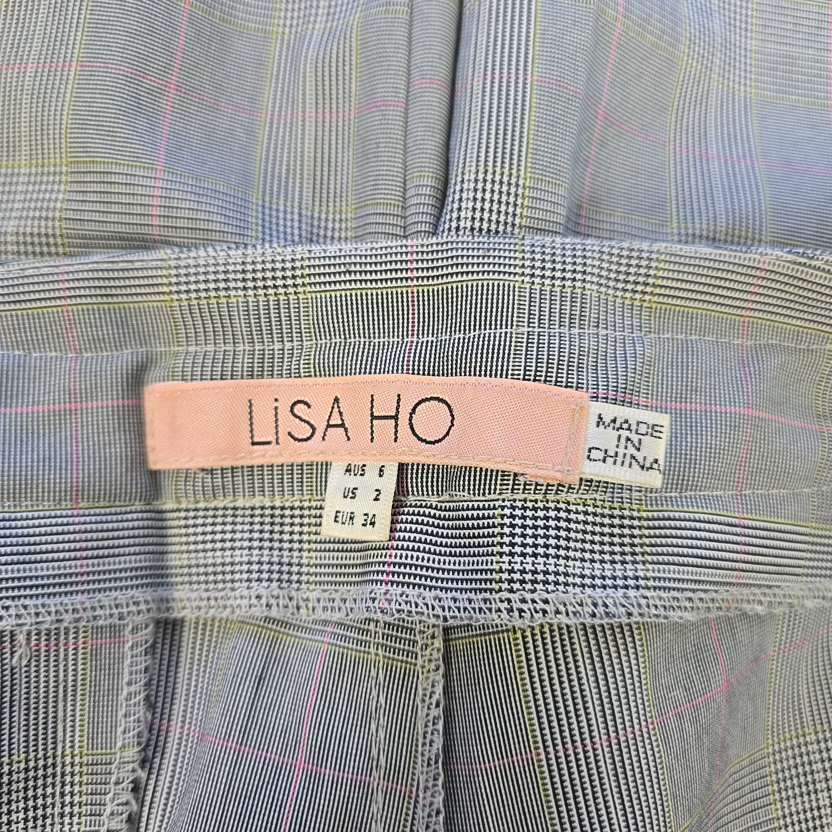Fabric with a visible brand label on a checkered background