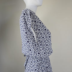 Mannequin wearing a patterned outfit with a plain background