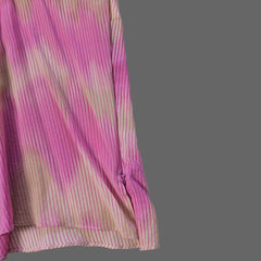 Pink and brown striped fabric on a light gray background