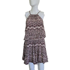 Patterned dress on a mannequin against a plain background