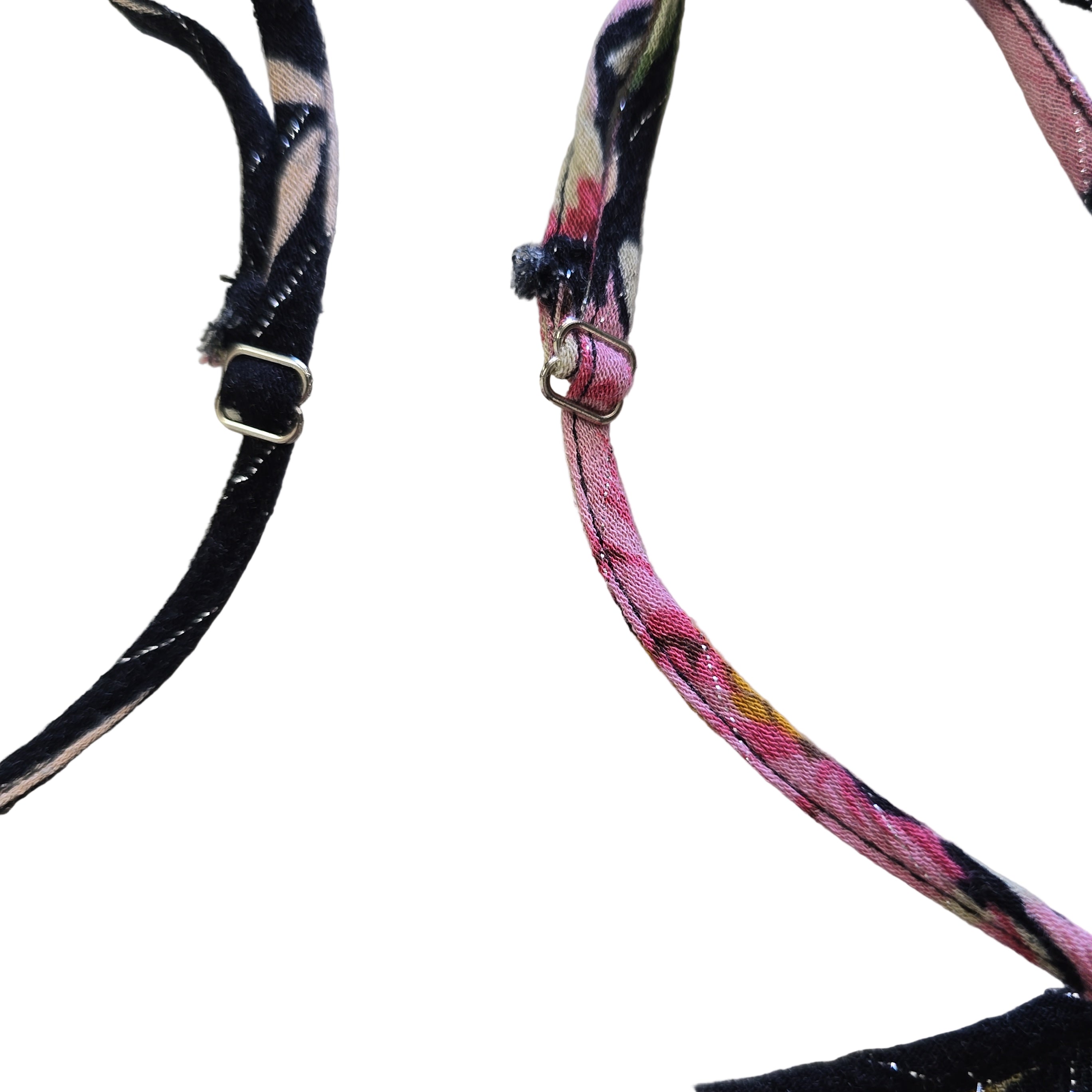 Black floral-patterned top on a light background