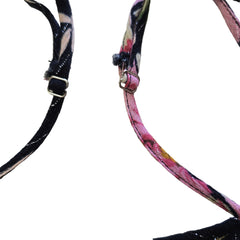 Black floral-patterned top on a light background