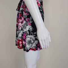 Floral-patterned dress on a mannequin against a neutral background