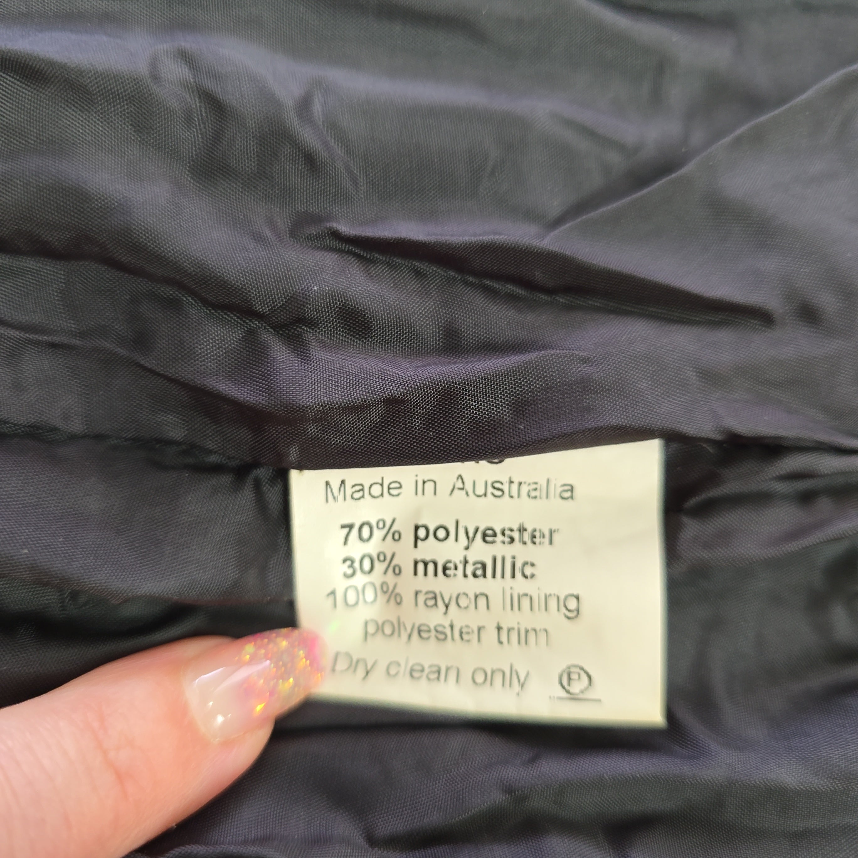 Clothing label on a dark fabric background