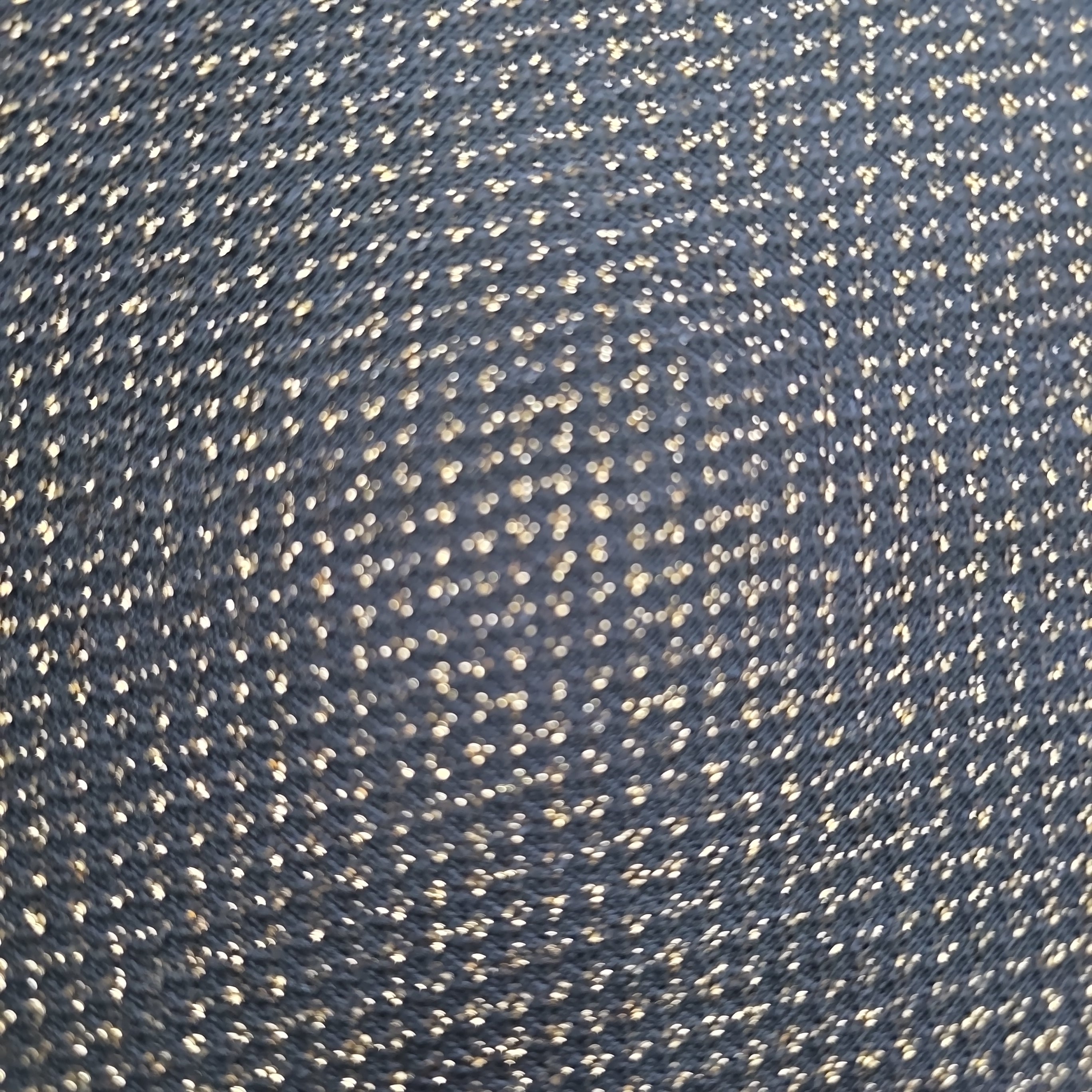 Close-up of a textured blue fabric with a subtle pattern