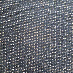 Close-up of a textured blue fabric with a subtle pattern