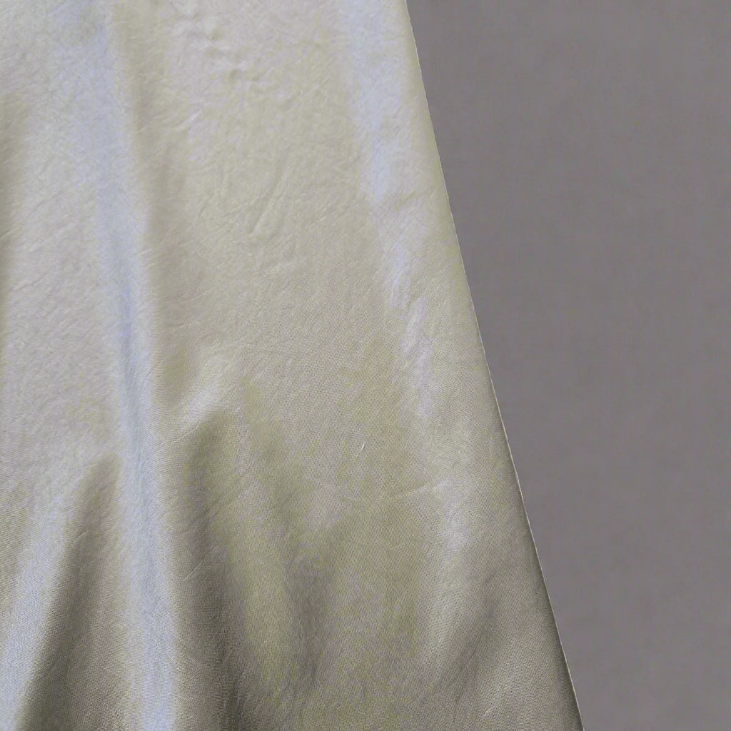 Close-up of a textured fabric with a tiled background