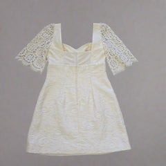 White lace dress on a tiled floor