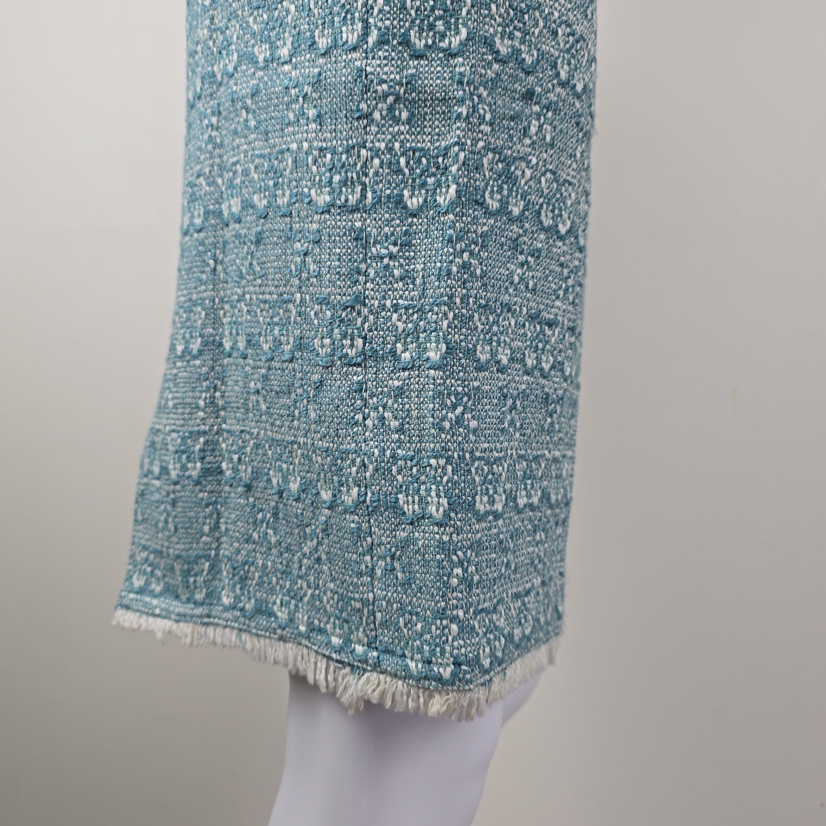 Textured blue skirt on a light gray background