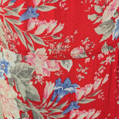 Close-up of a red fabric with floral pattern
