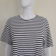 Black and white striped top on a mannequin against a plain background