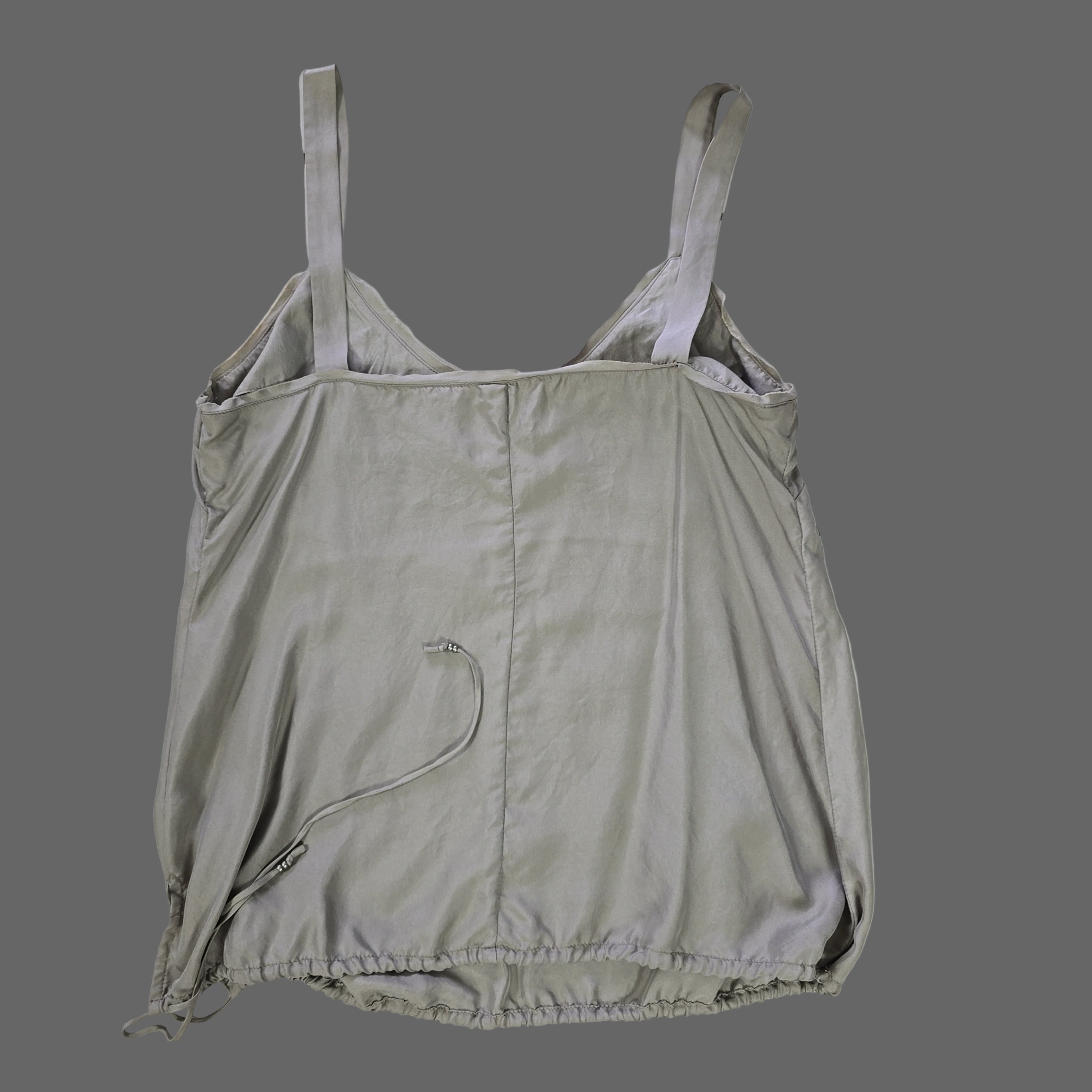 Light gray top on a tiled floor