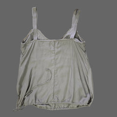 Light gray top on a tiled floor