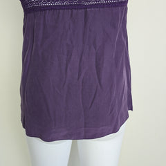 Purple lace-trimmed top on a light background