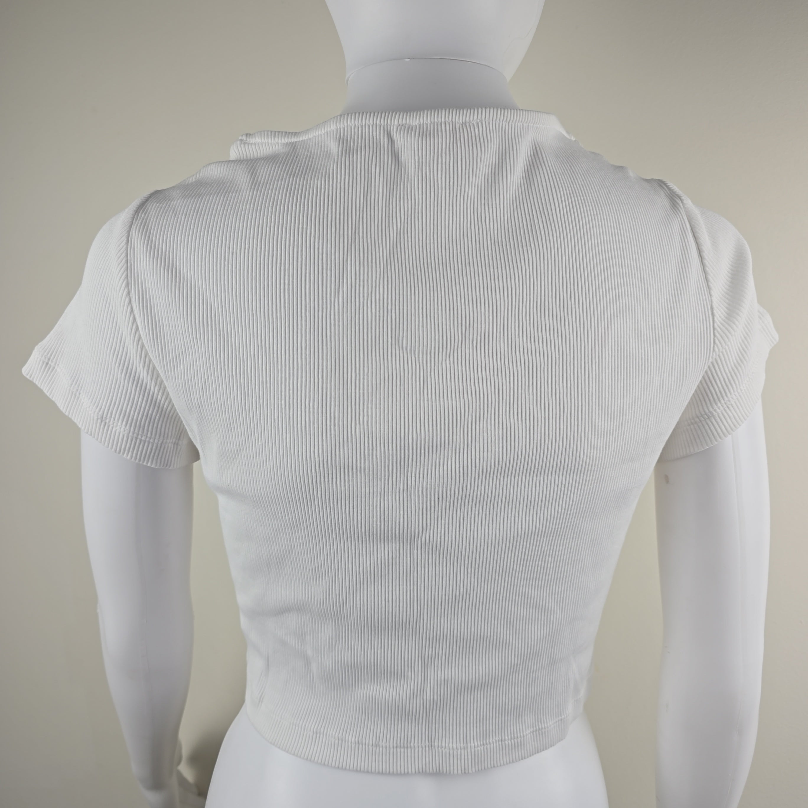 White top on a beige background