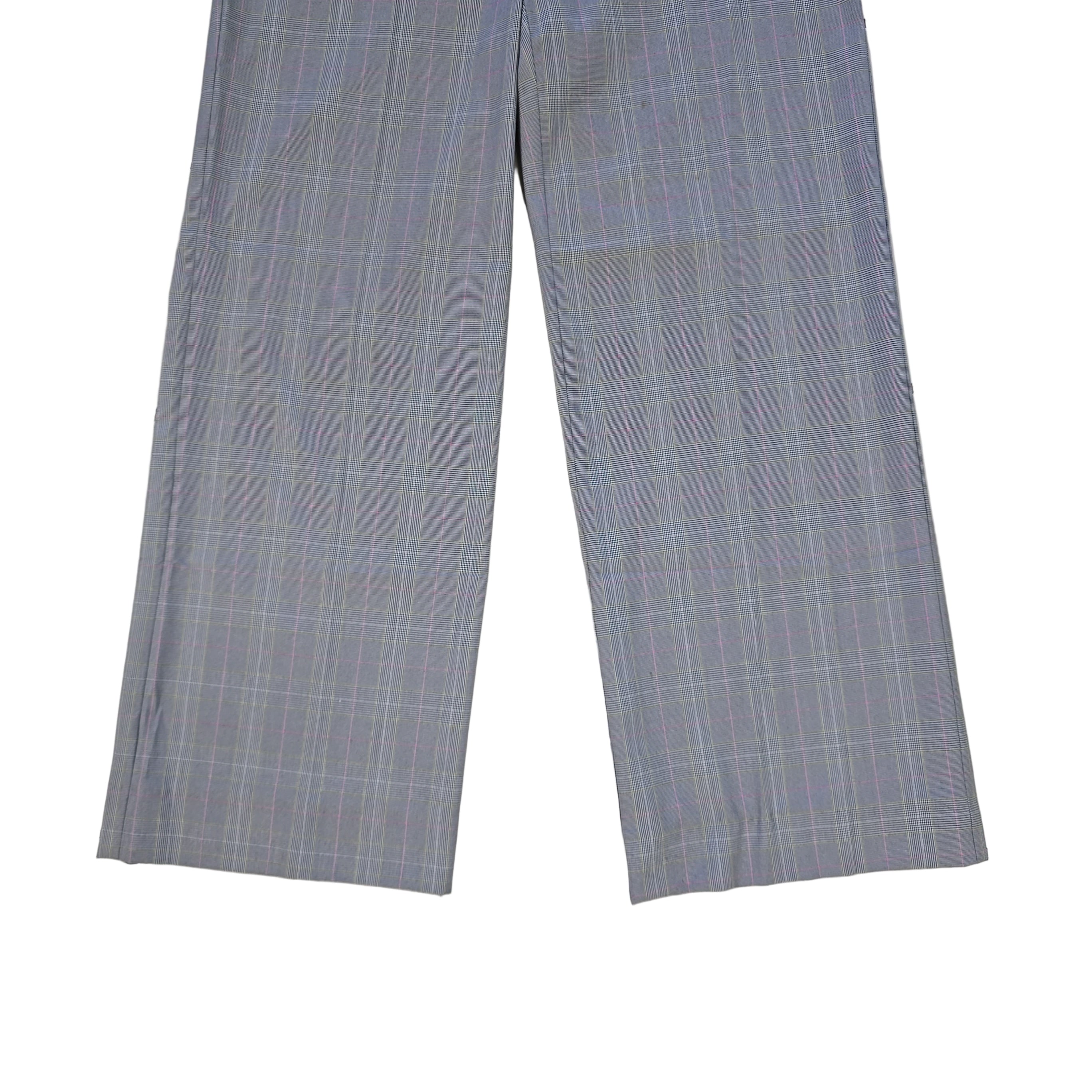 Two gray checkered pant legs on a tiled floor.