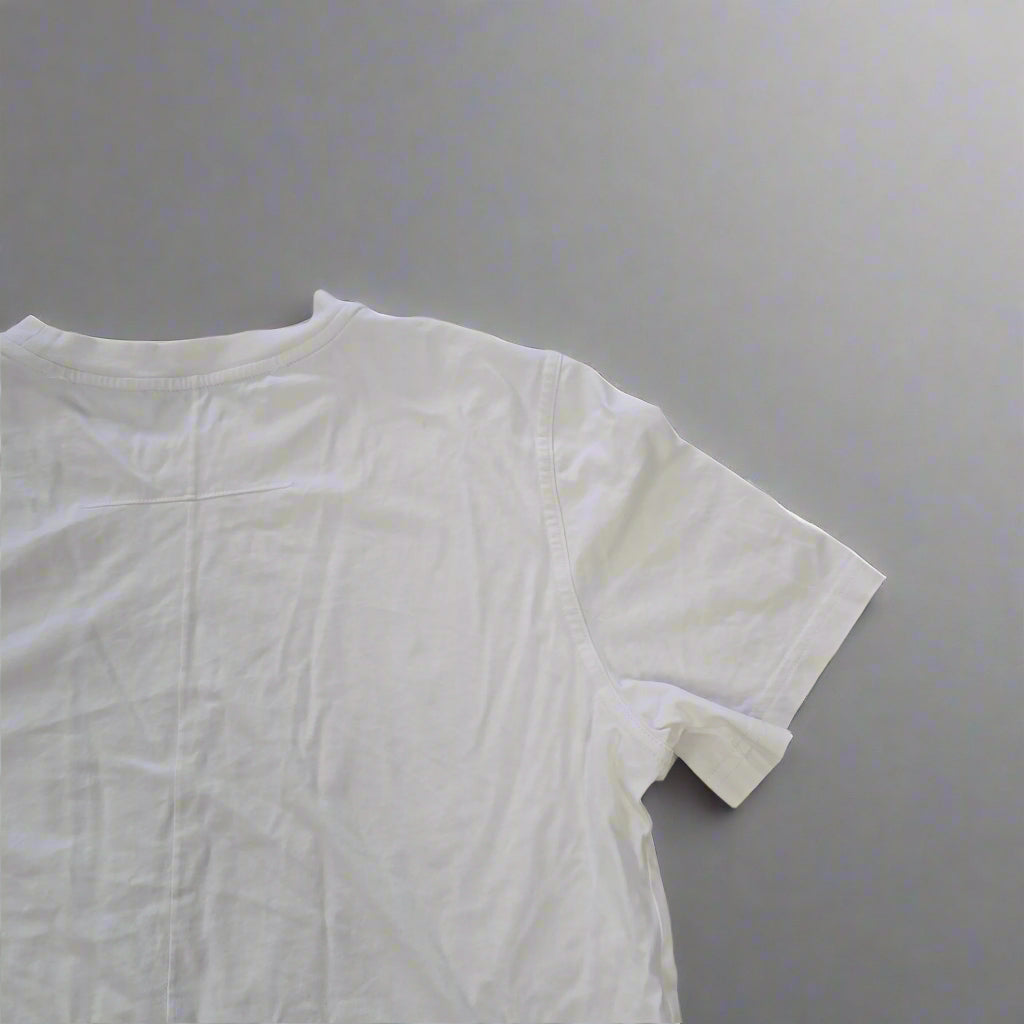 White t-shirt on a tiled floor