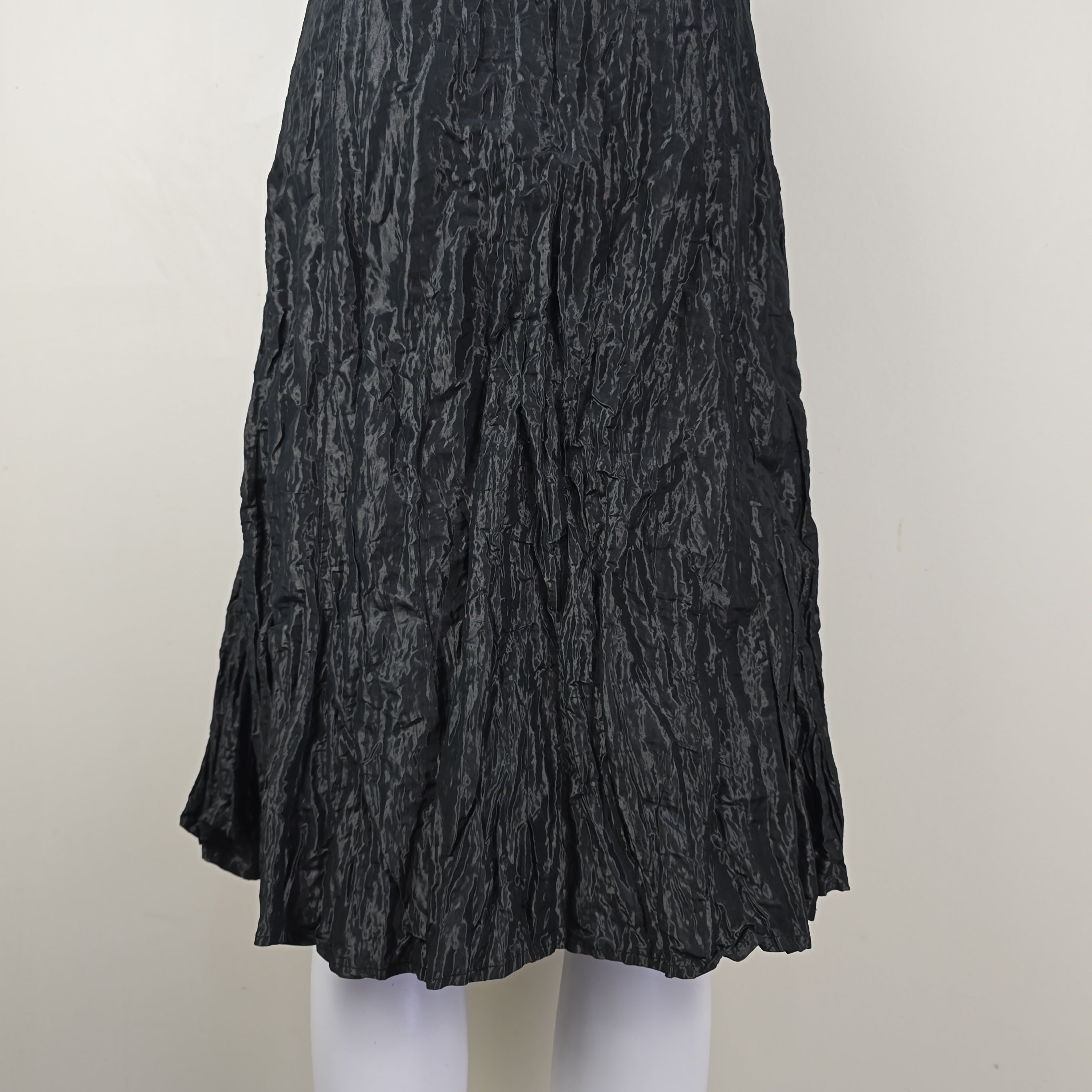 Black crumpled skirt on a white background
