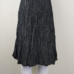 Black crumpled skirt on a white background
