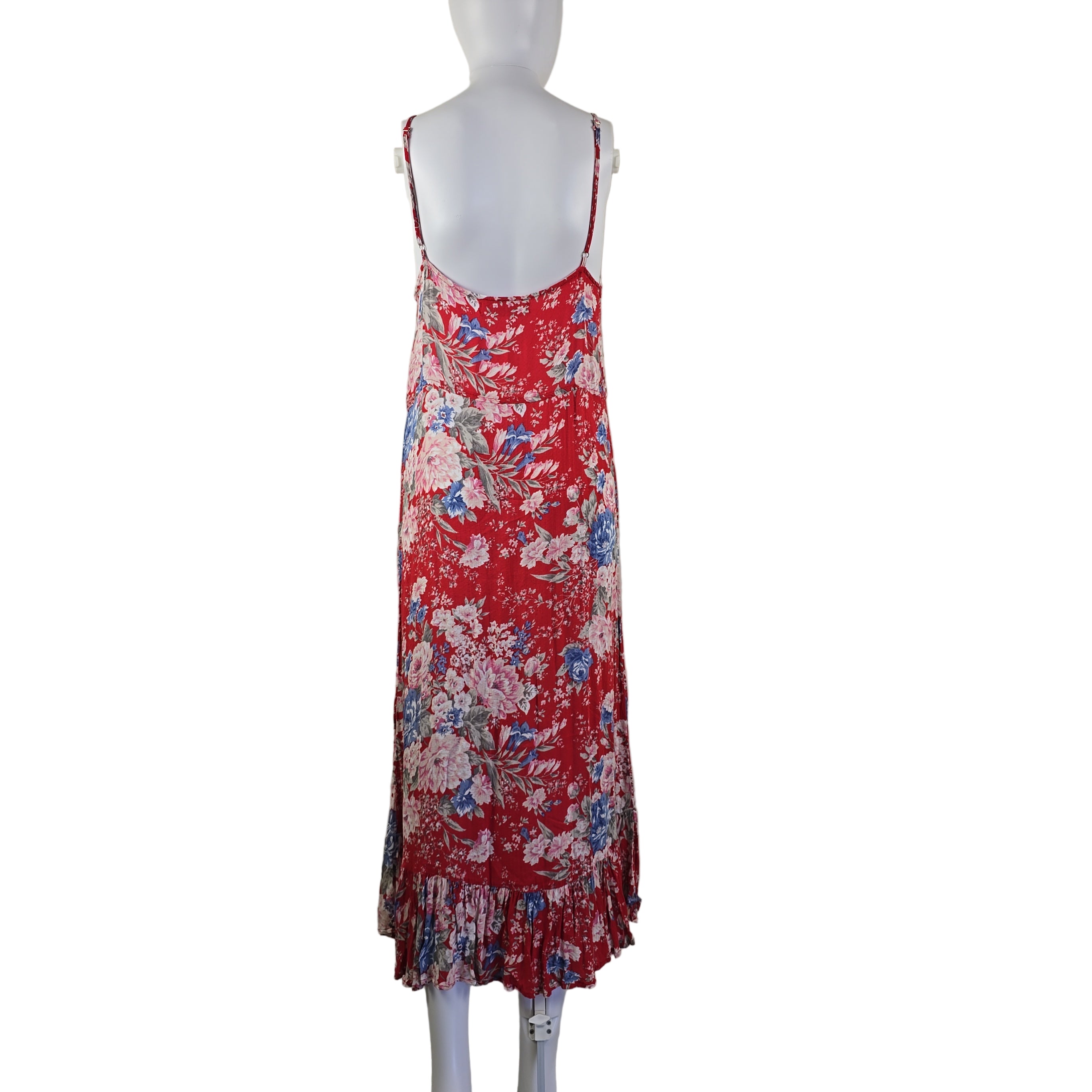 Red floral dress on a mannequin against a white wall