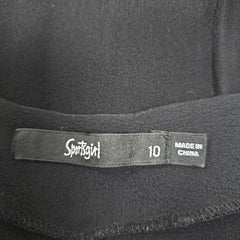 Close-up of a label on a black garment with 'Sportsgirl' brand name.
