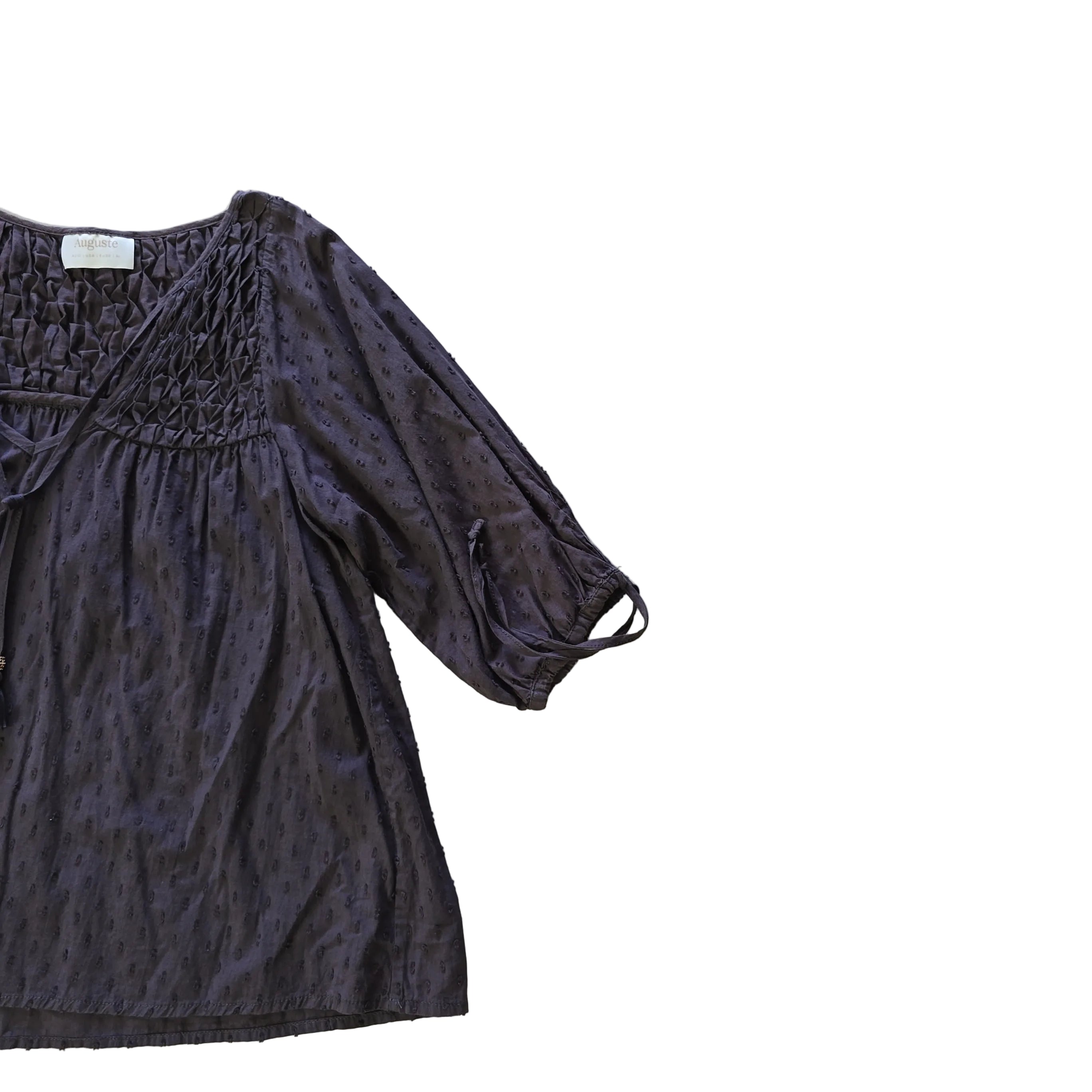 Brown long-sleeve top on a light background