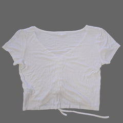 White top on a tiled floor