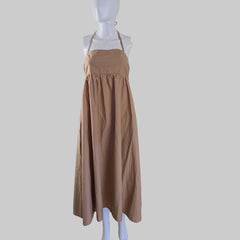Brown strapless dress on a mannequin against a white background