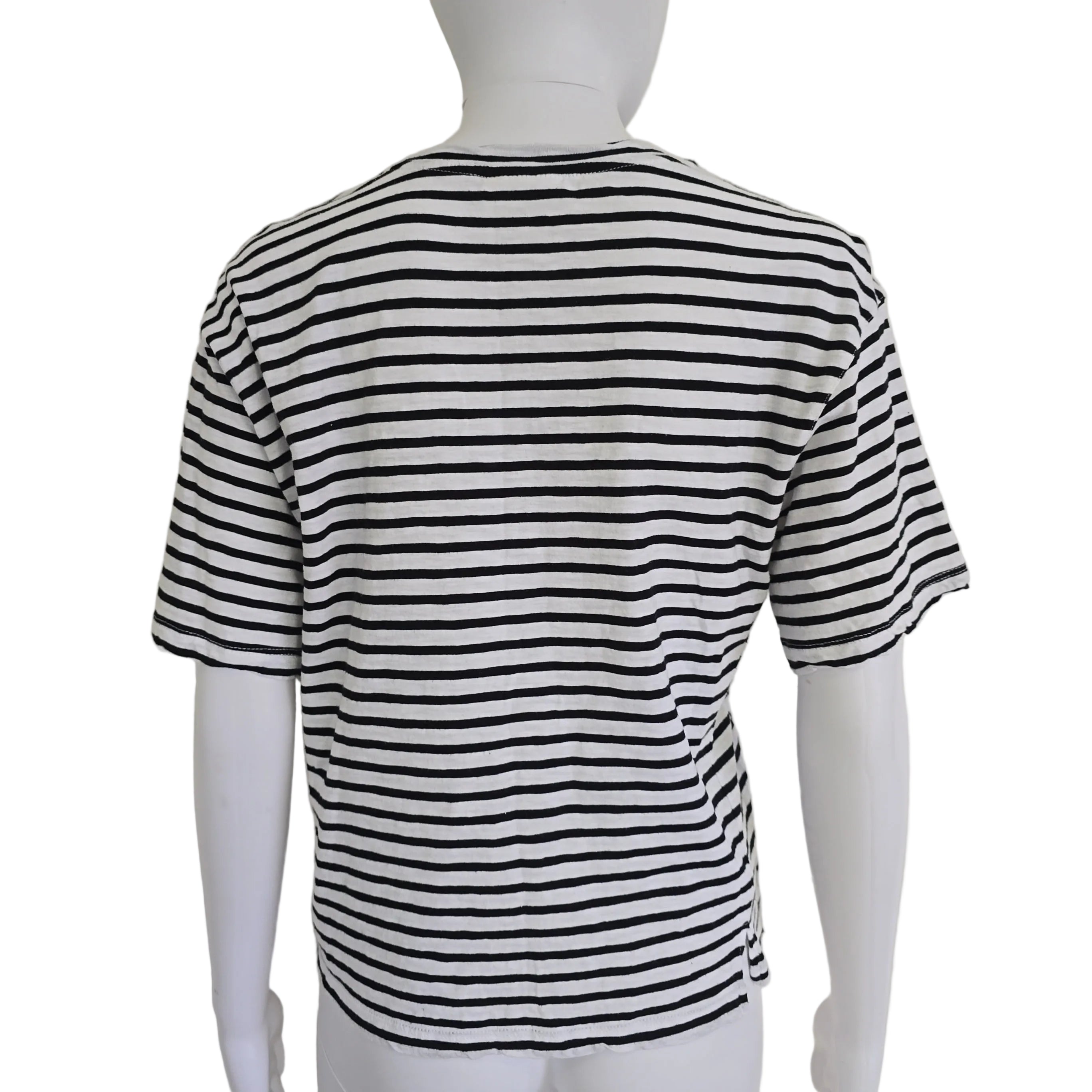 Black and white striped shirt on a mannequin against a plain background