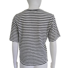 Black and white striped shirt on a mannequin against a plain background
