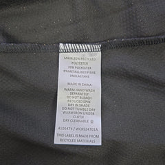 Clothing label on a dark fabric background