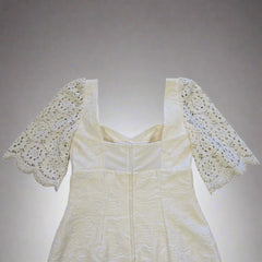 White lace dress on a tiled floor
