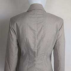 Gray jacket on a mannequin against a white background