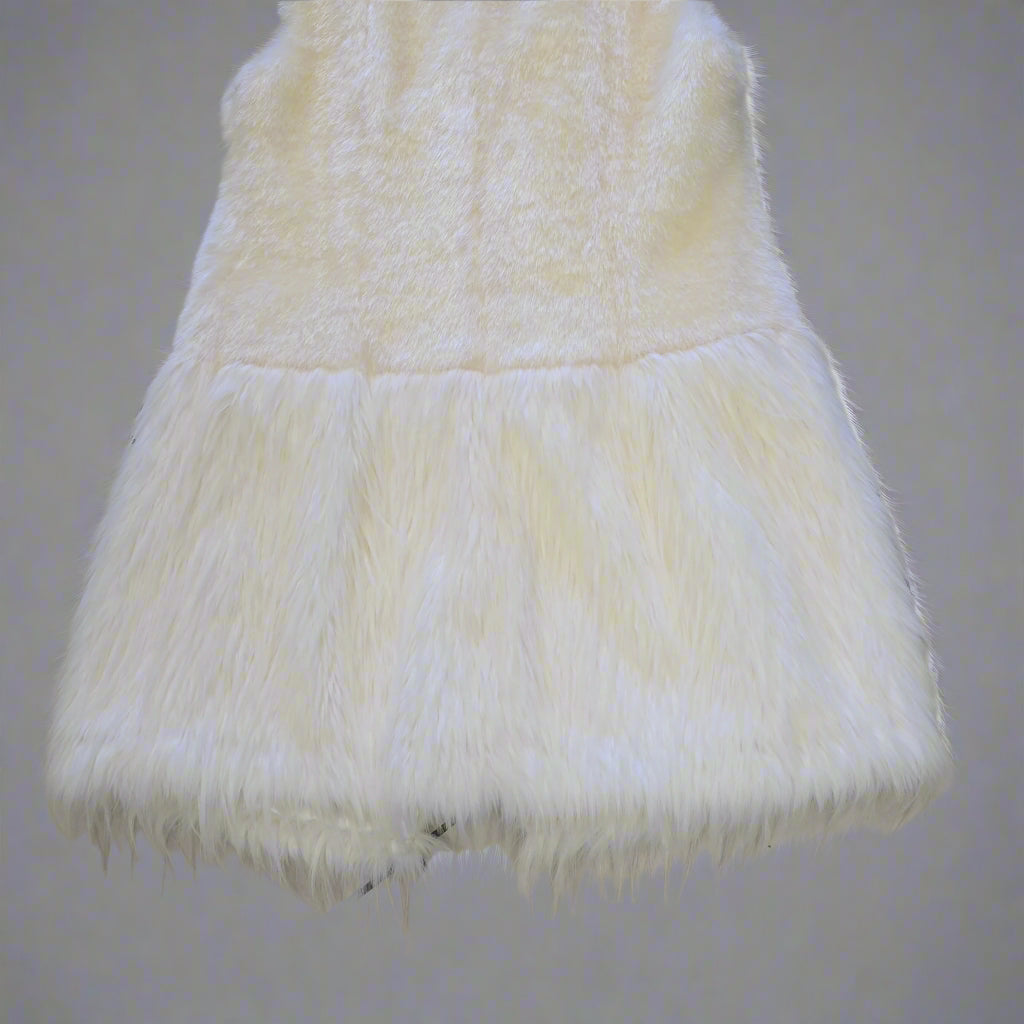 White fur Vest on a tiled floor