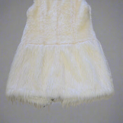 White fur Vest on a tiled floor