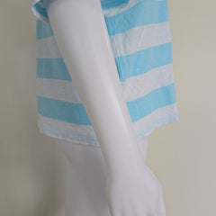 Light blue and white striped shirt on a light background