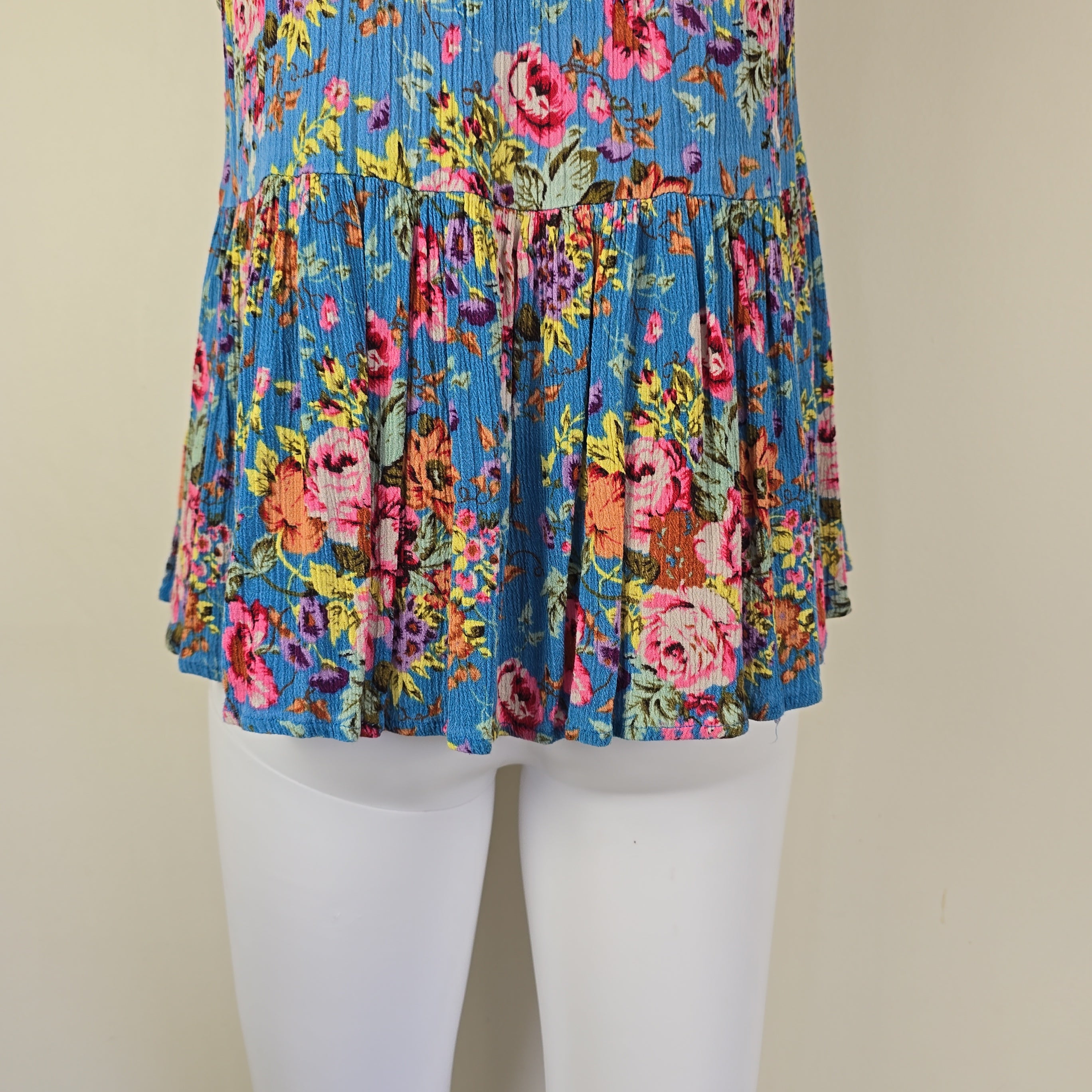 Blue floral top with on a light background