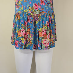 Blue floral top with on a light background