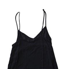 Black dress with beige lining on a light background