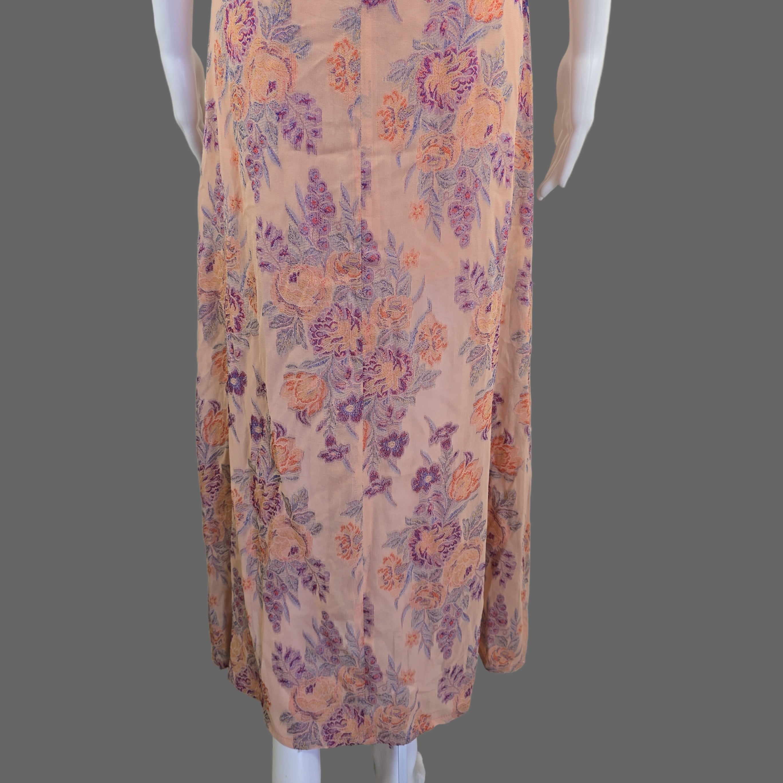 Floral-patterned fabric on a mannequin against a white wall