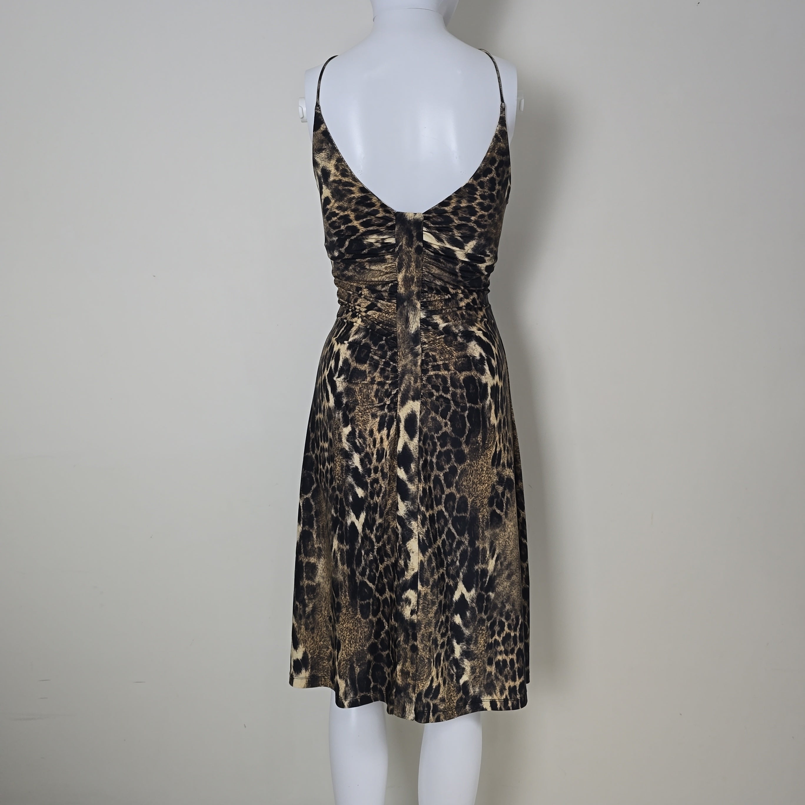 Leopard print dress on a mannequin against a plain background