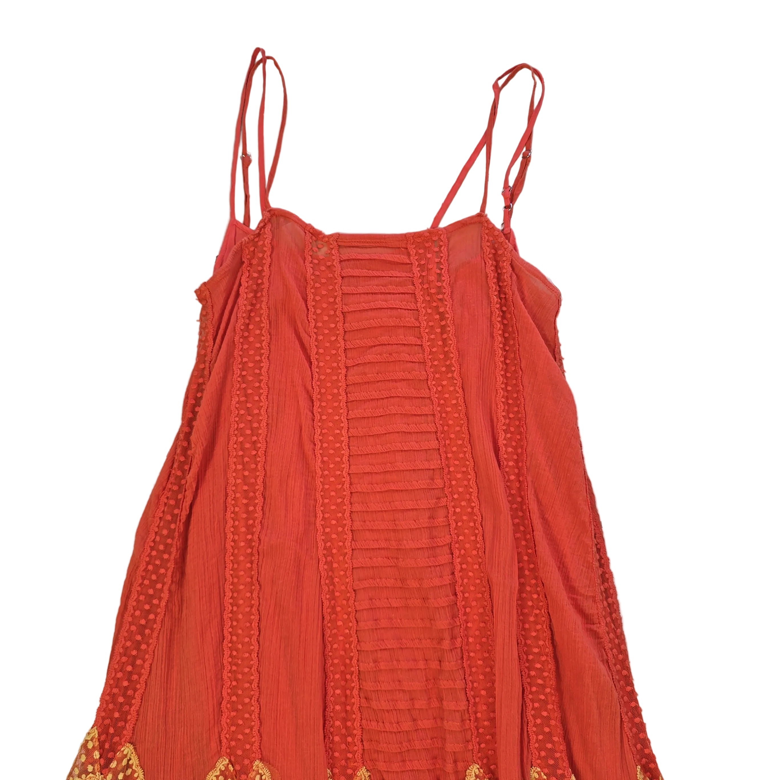 Orange dress with yellow embroidery on a light background