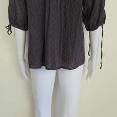 Brown long-sleeve top on a light background