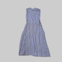 Blue floral strapless dress on a tiled floor